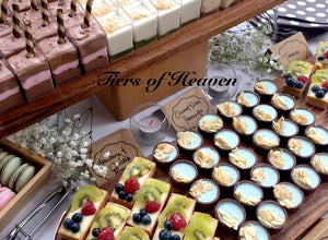 Dessert Buffet Table with Assorted Dessert Cups Mini Tarts Macarons