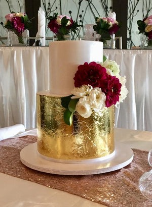 2 tier wedding cake gold leaf flowers