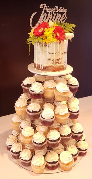 naked birthday cake with cupcakes flowers wooden topper