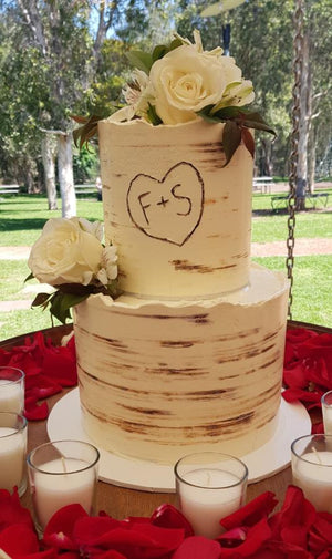 tree bark wedding cake rustic initials carving flowers