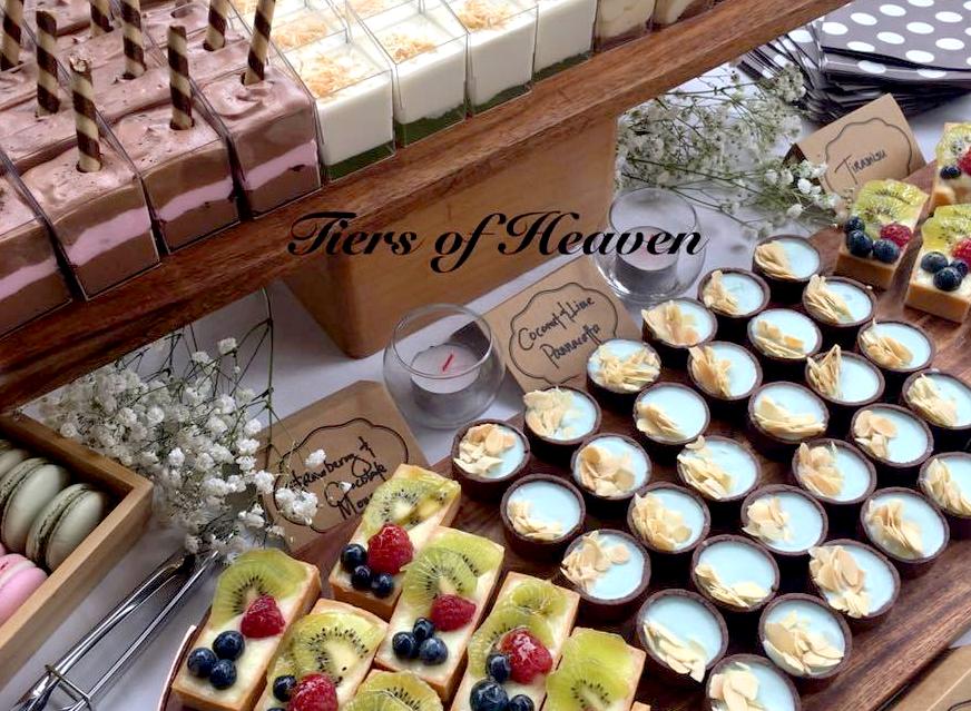 Dessert Buffet Table with Assorted Dessert Cups Mini Tarts Macarons