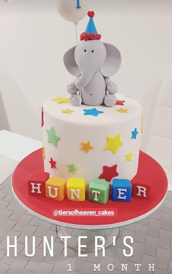 Monthsary cake with grey elephant stars and building blocks