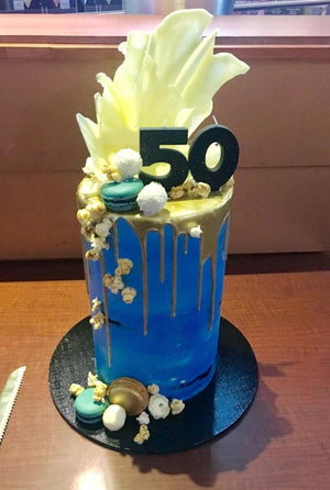 50th birthday drip cake chocolate sail macaron